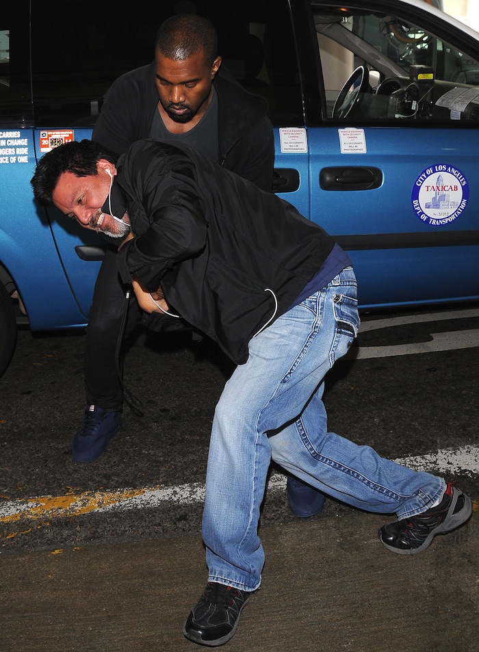 Kanye West Tussles With A Photographer At LAX