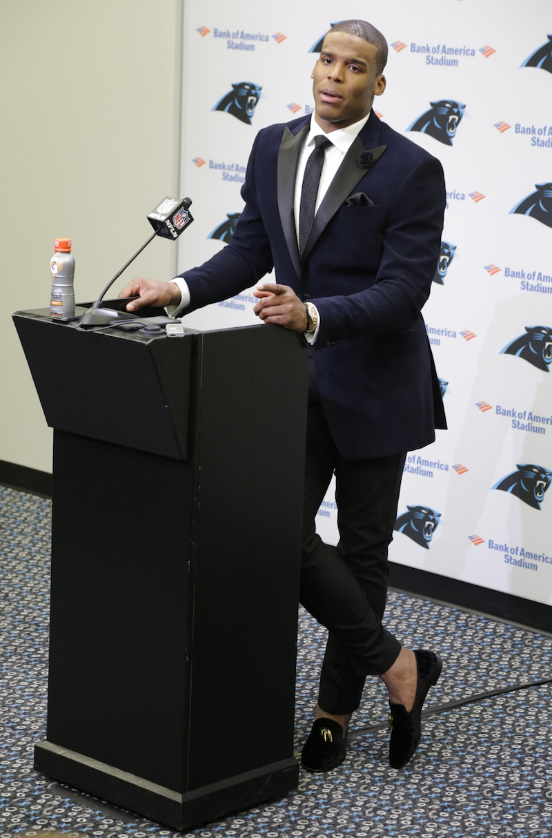 Carolina Panthers' Cam Newton speaks to the media after an NFL wild card playoff football game against the Arizona Cardinals in Charlotte, N.C., Saturday, Jan. 3, 2015. The Panthers won 27-16. (AP Photo/Bob Leverone)